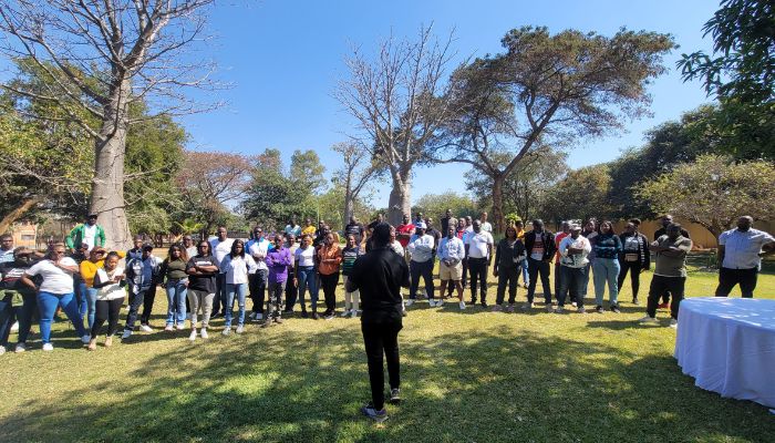 Participants at an Acme outdoor team learning activity